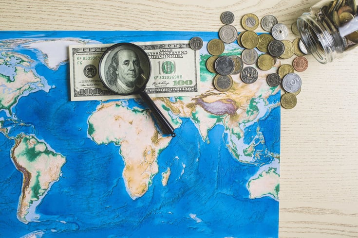 map-world-with-money-magnifying-glass (1) (1)