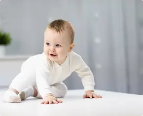 naked-baby-white-suit-sitting-bright-room